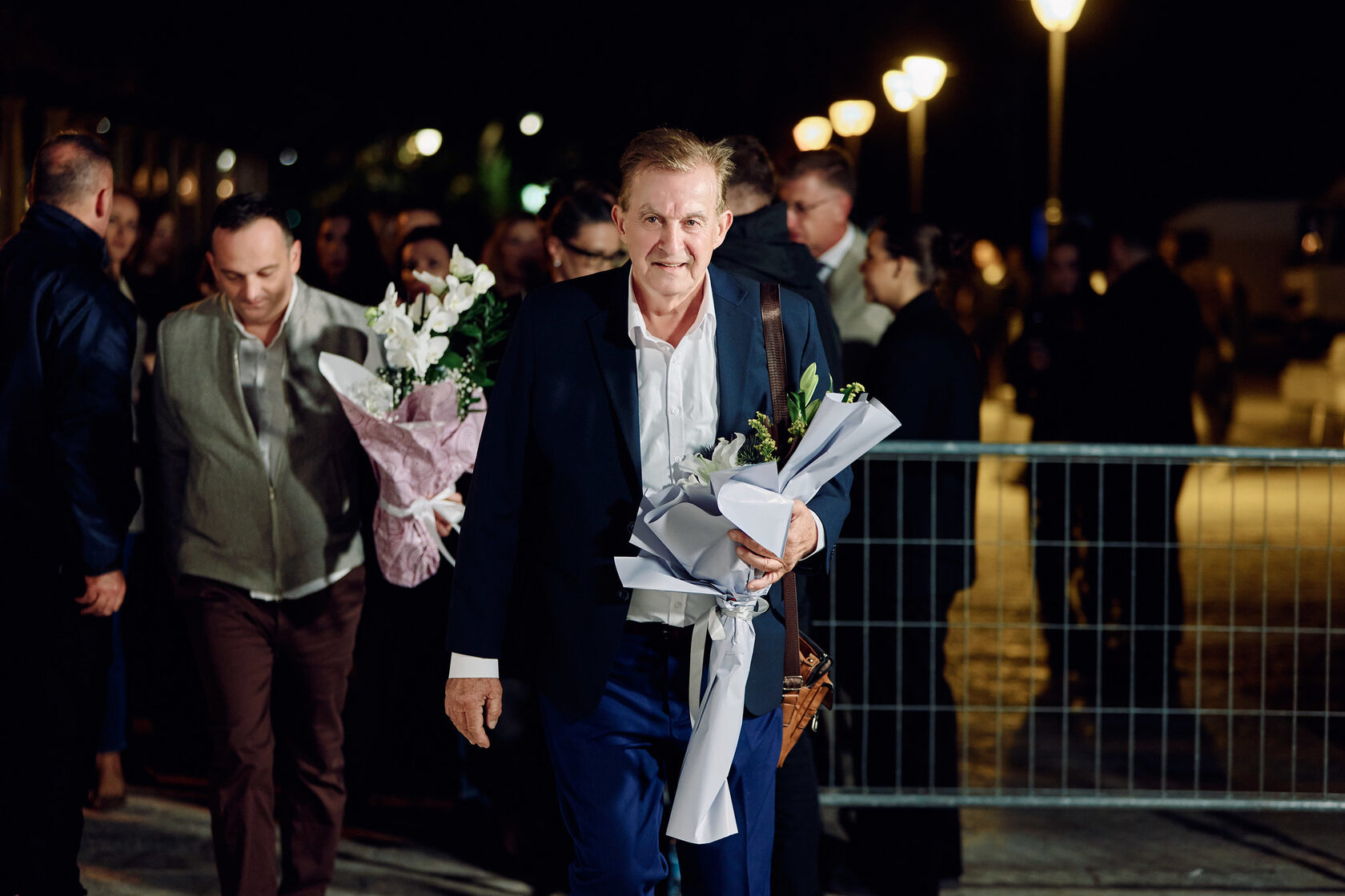 A guest arriving with a bouquet
