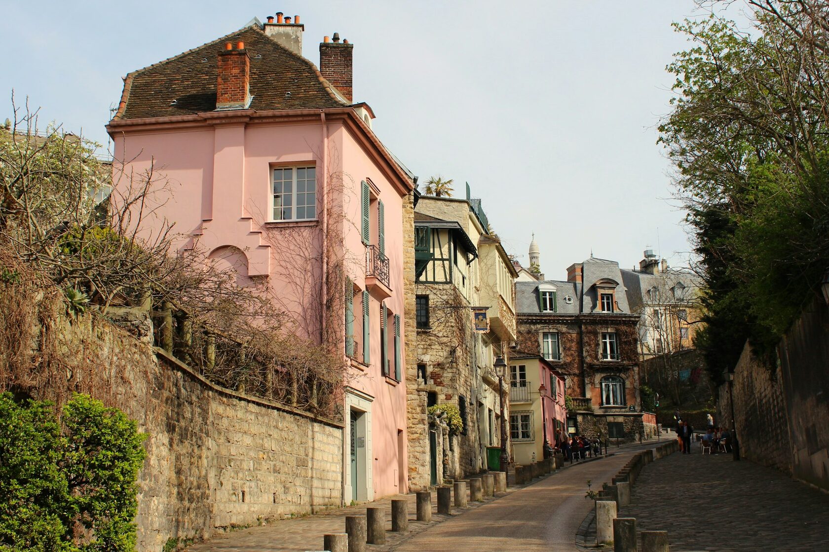 Painters at their easels beneath the trees of the Place du Tertre in Montmartre