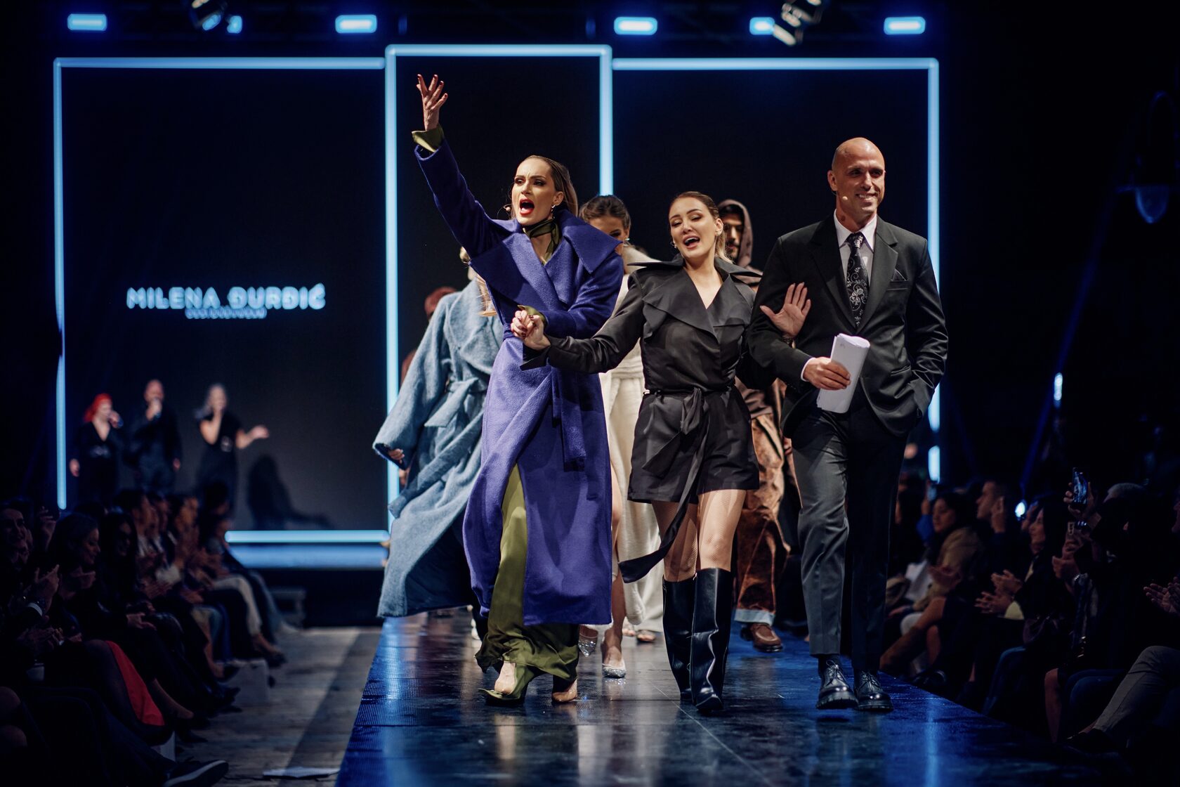 Milena and the hosts greeting the audience