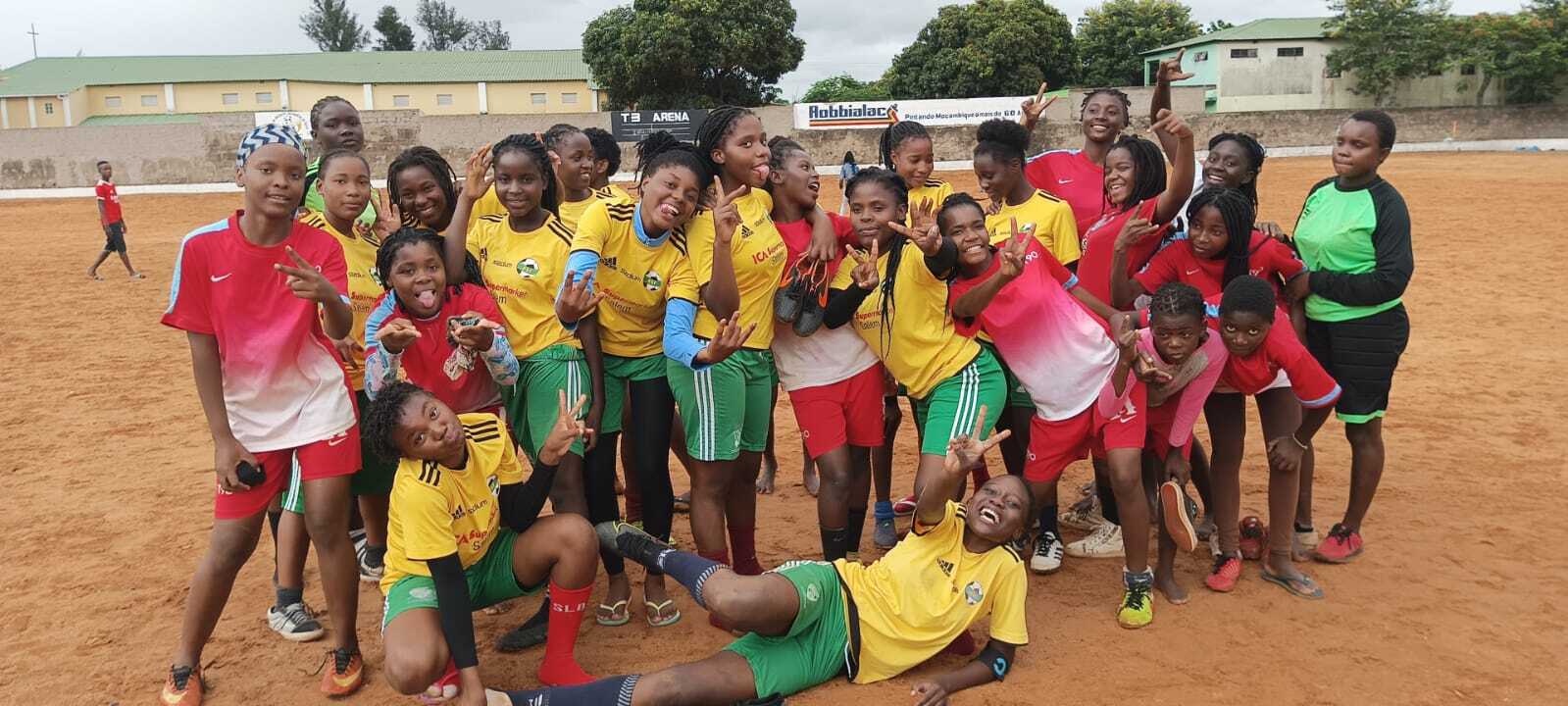 Mutola Cup players celebrating together on the pitch