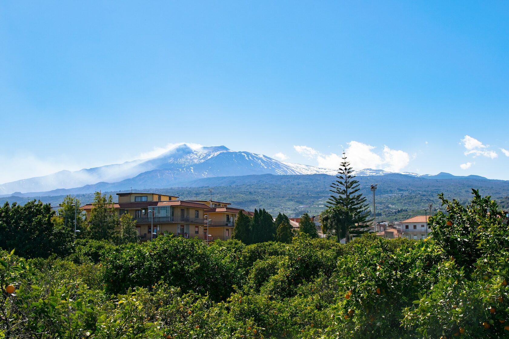 The ancient Greek theater of Taormina with Mount Etna rising behind it