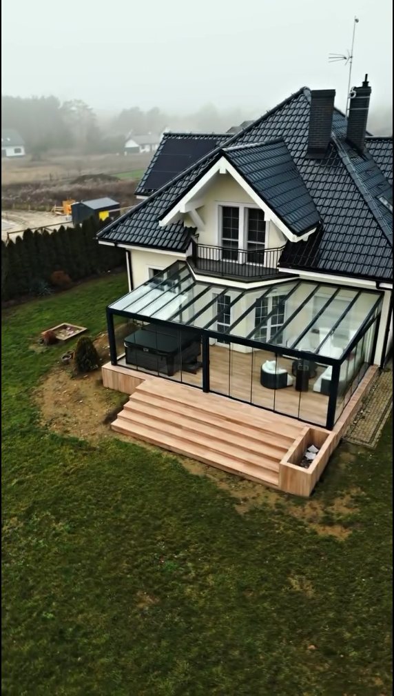 Glass roof winter garden beside a house