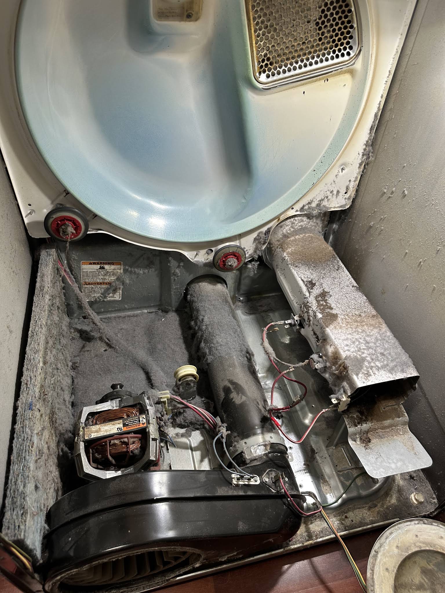 Dryer opened with the drum removed during an appliance repair in San Antonio, FL by AVM Services