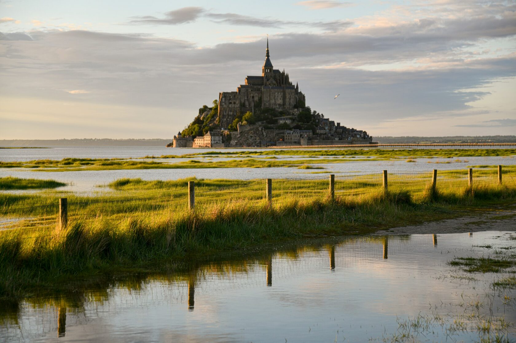 Mont-Saint-Michel at dusk reflected in the tide