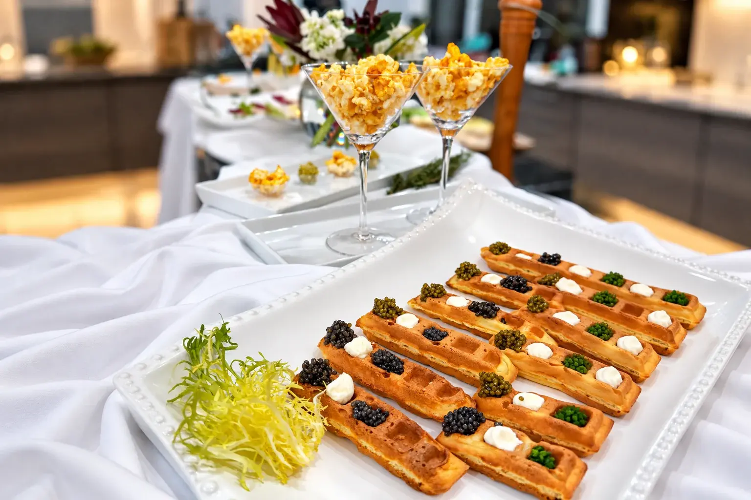 Crispy waffles topped with caviar — a New Year's Eve dinner at home by Miami private chef Marina Staver