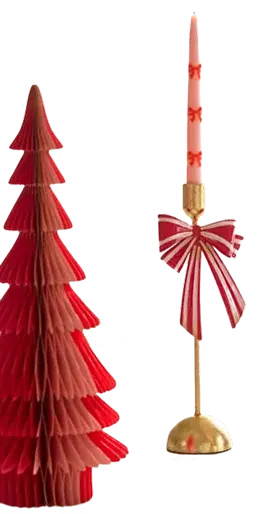 Red paper Christmas tree beside a striped-bow candlestick
