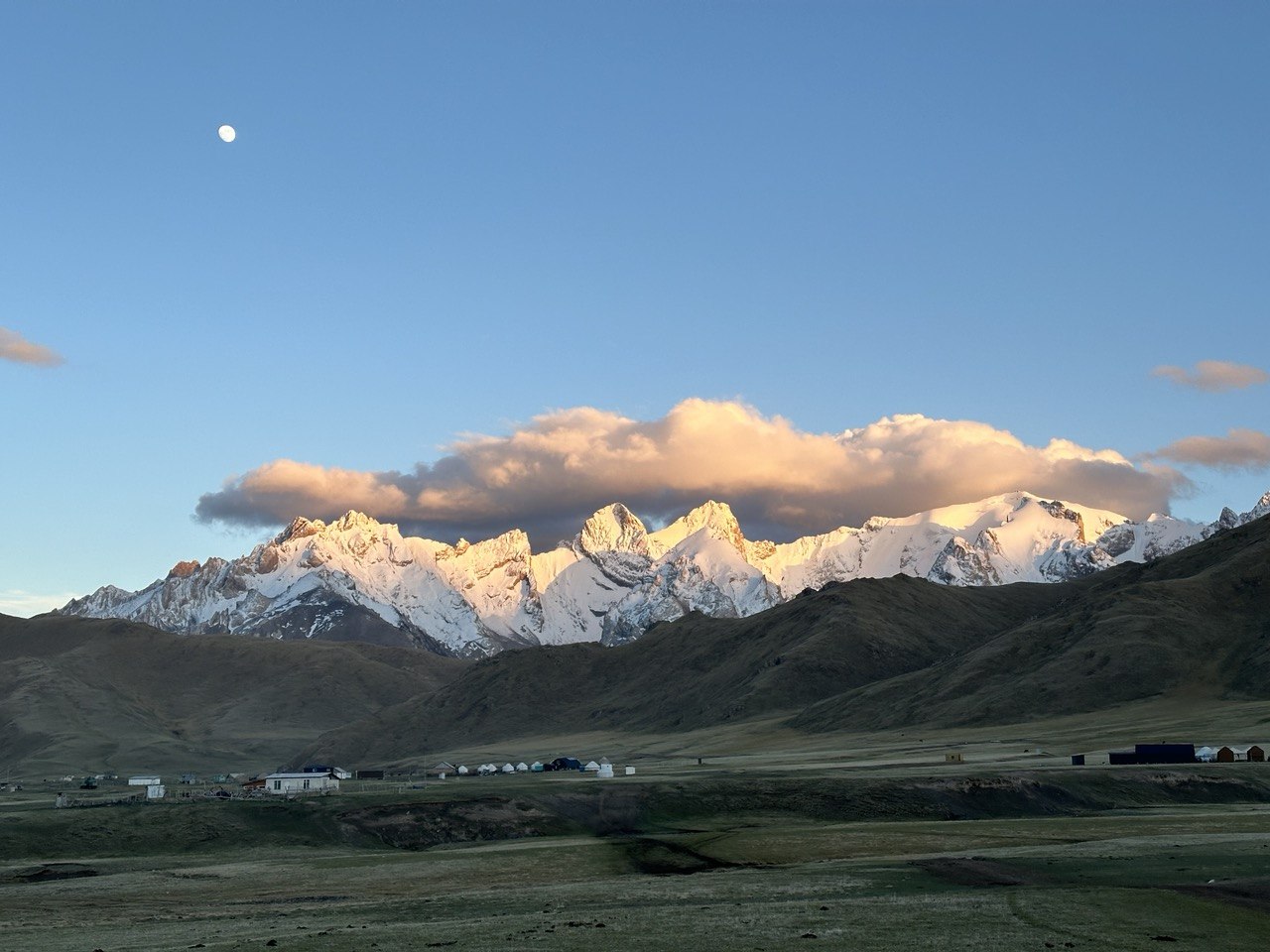 Remote mountain road and vast highland valley near Kok-Kiya