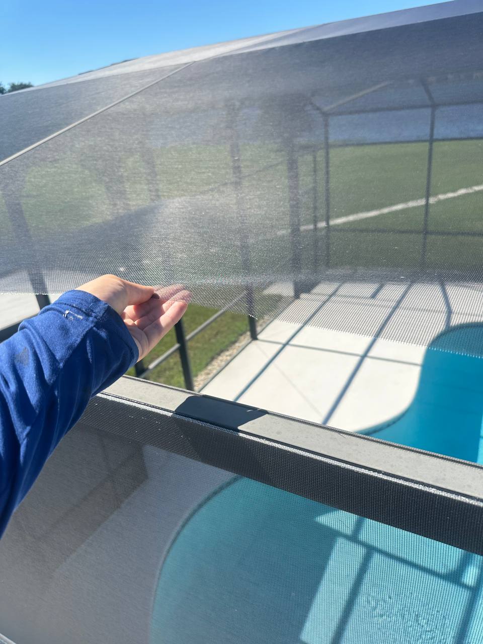 Pool cage screen ripped out of the frame by wind