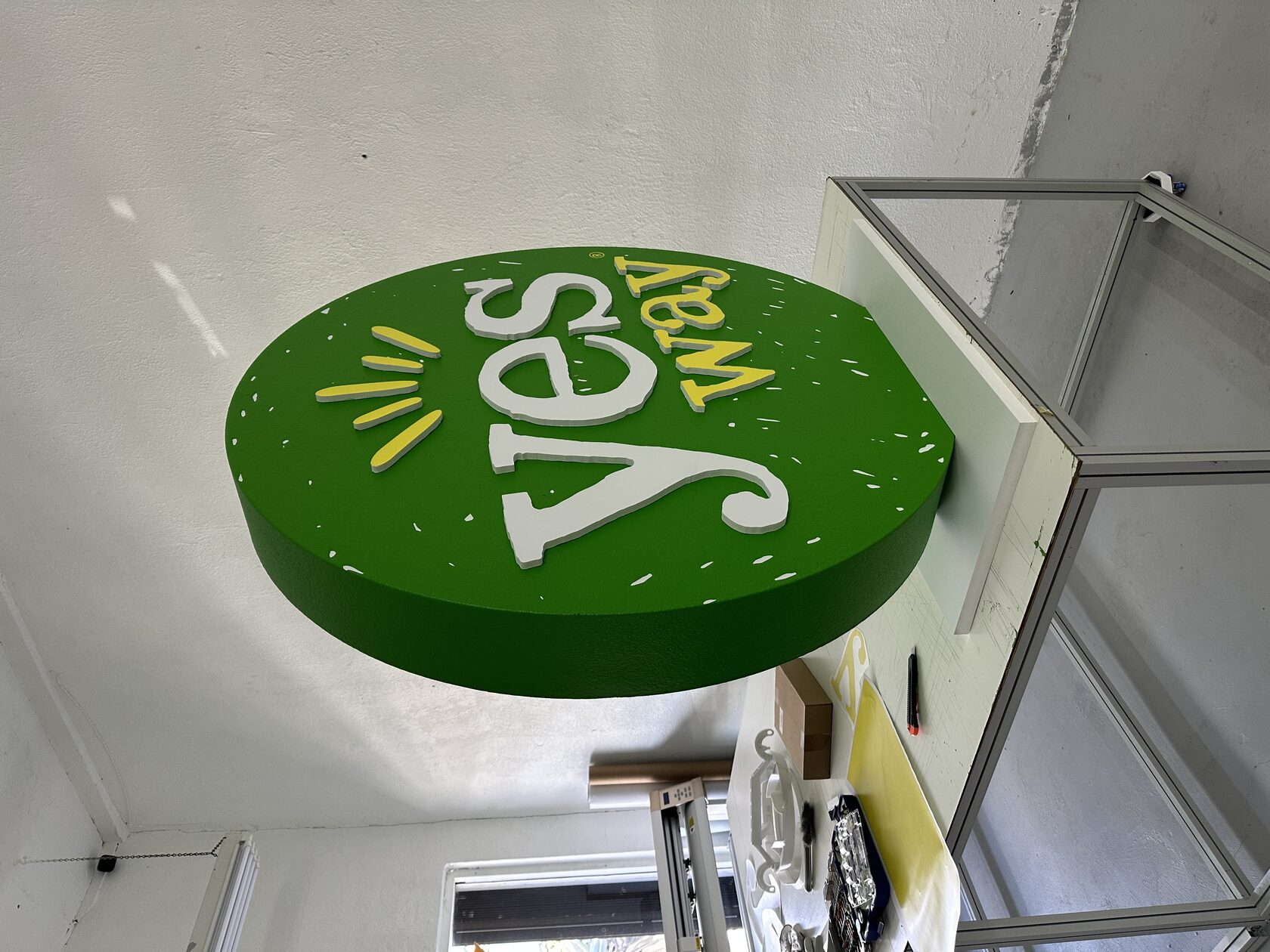 Side view of the hard-coated Yesway foam logo showing raised half-inch PVC details and one-inch white PVC base