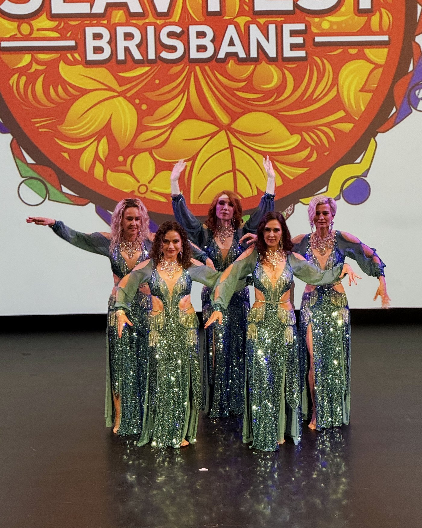 Dancers on stage in front of the SlavFest Brisbane banner
