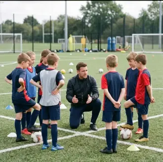 Coach holding two young athletes in a training hall