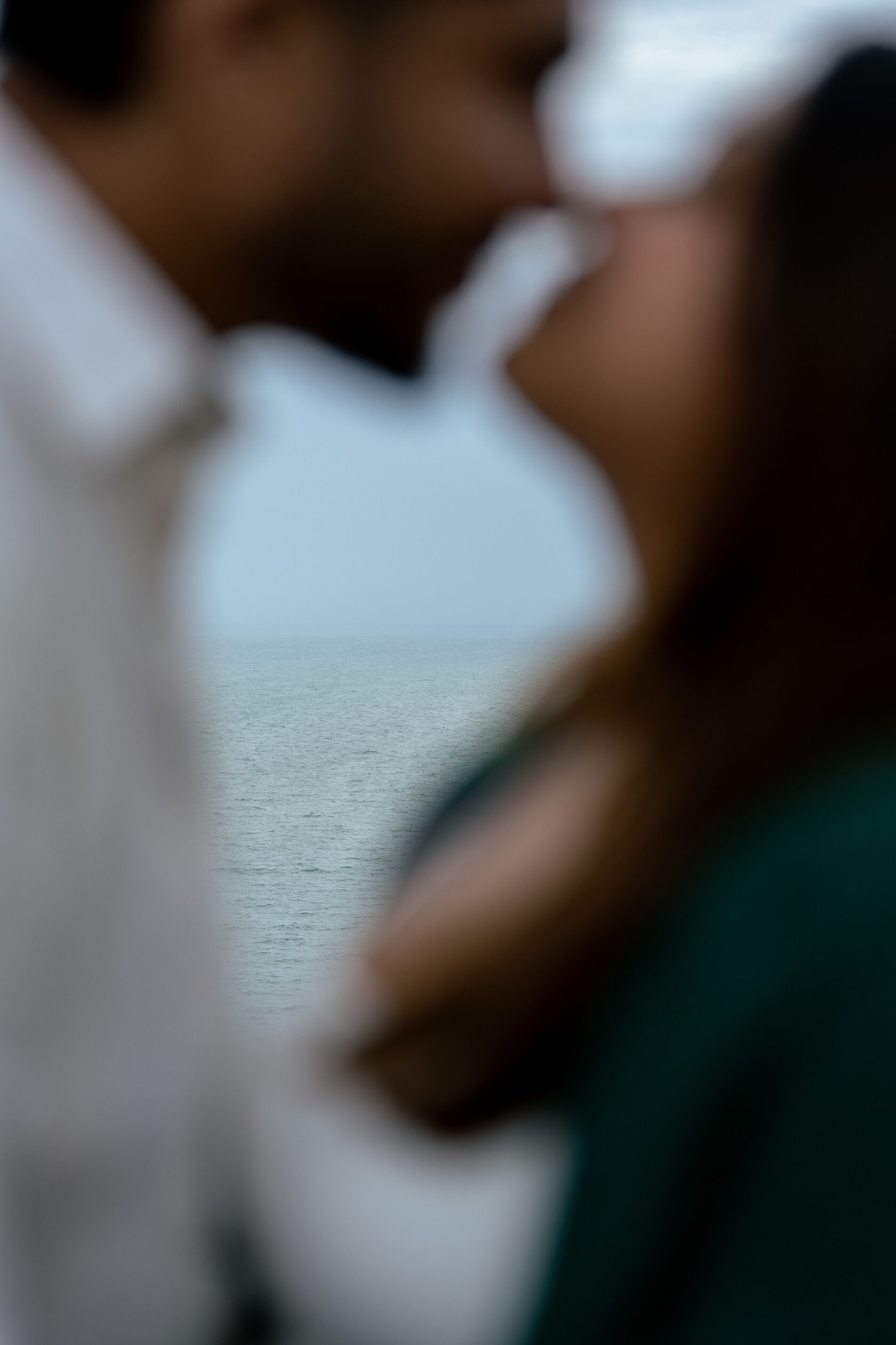 Soft-focus close-up of a couple leaning towards each other