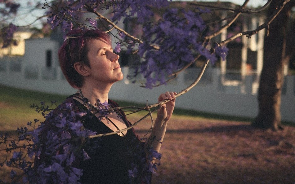 Anastasia Verchak under a jacaranda