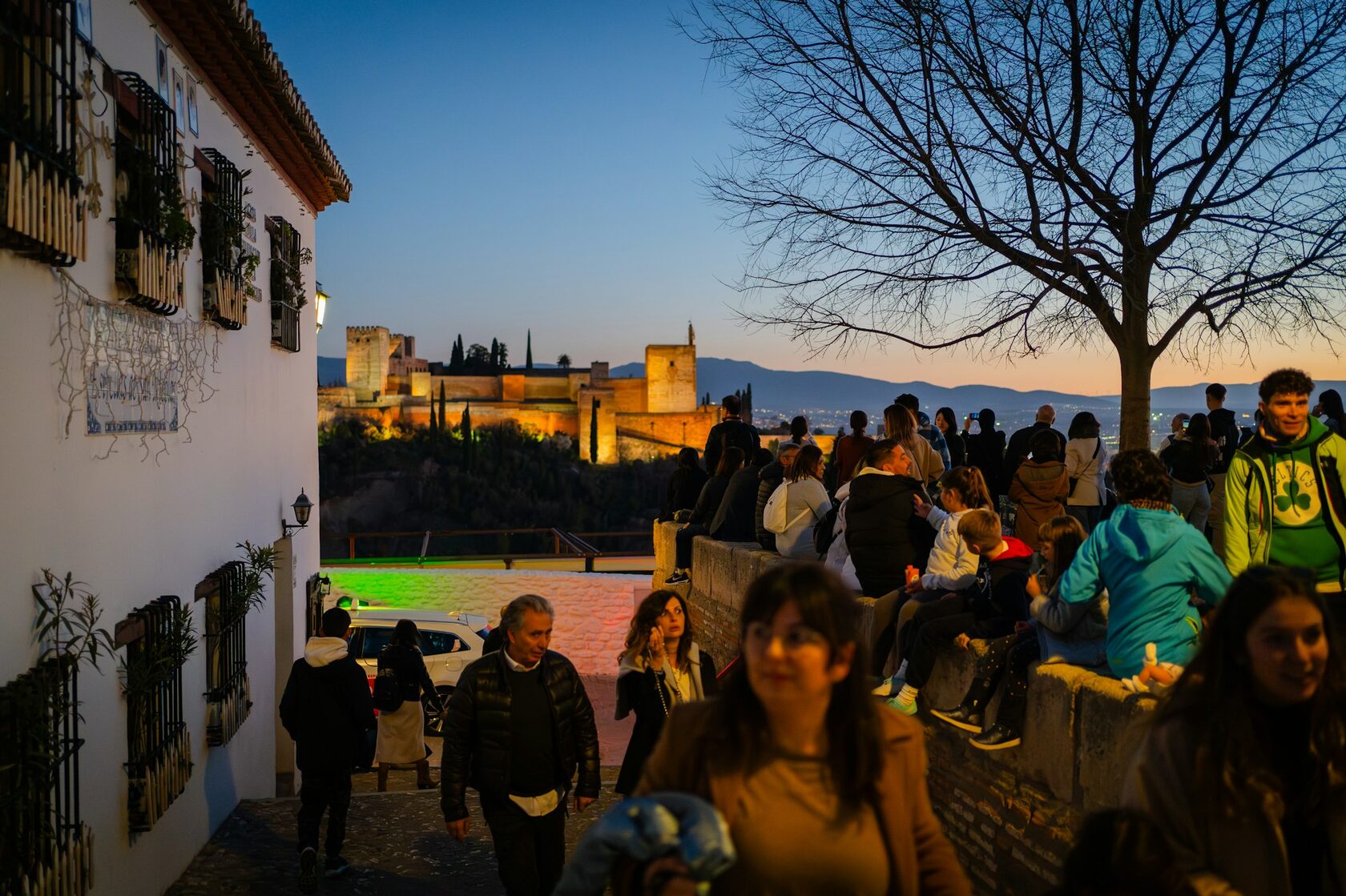 The Alhambra in Granada at sunset with the Sierra Nevada behind