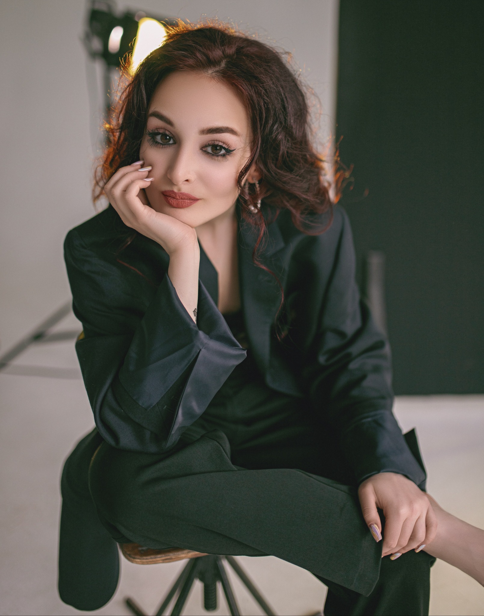 Dana Korn seated with her face resting on her hand