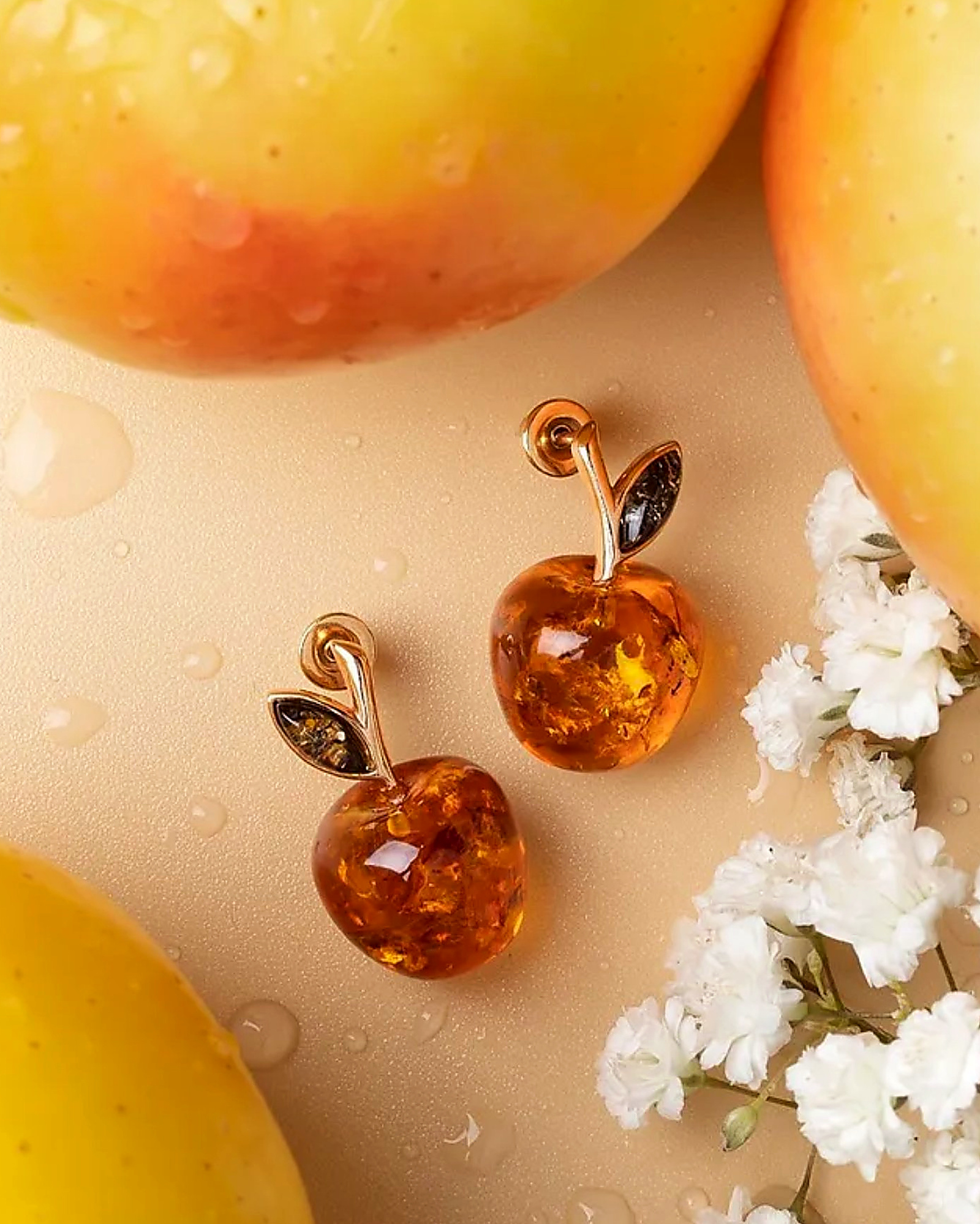 Pair of amber apple stud earrings with white blossoms