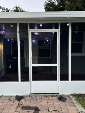 New white screen door on a screened lanai