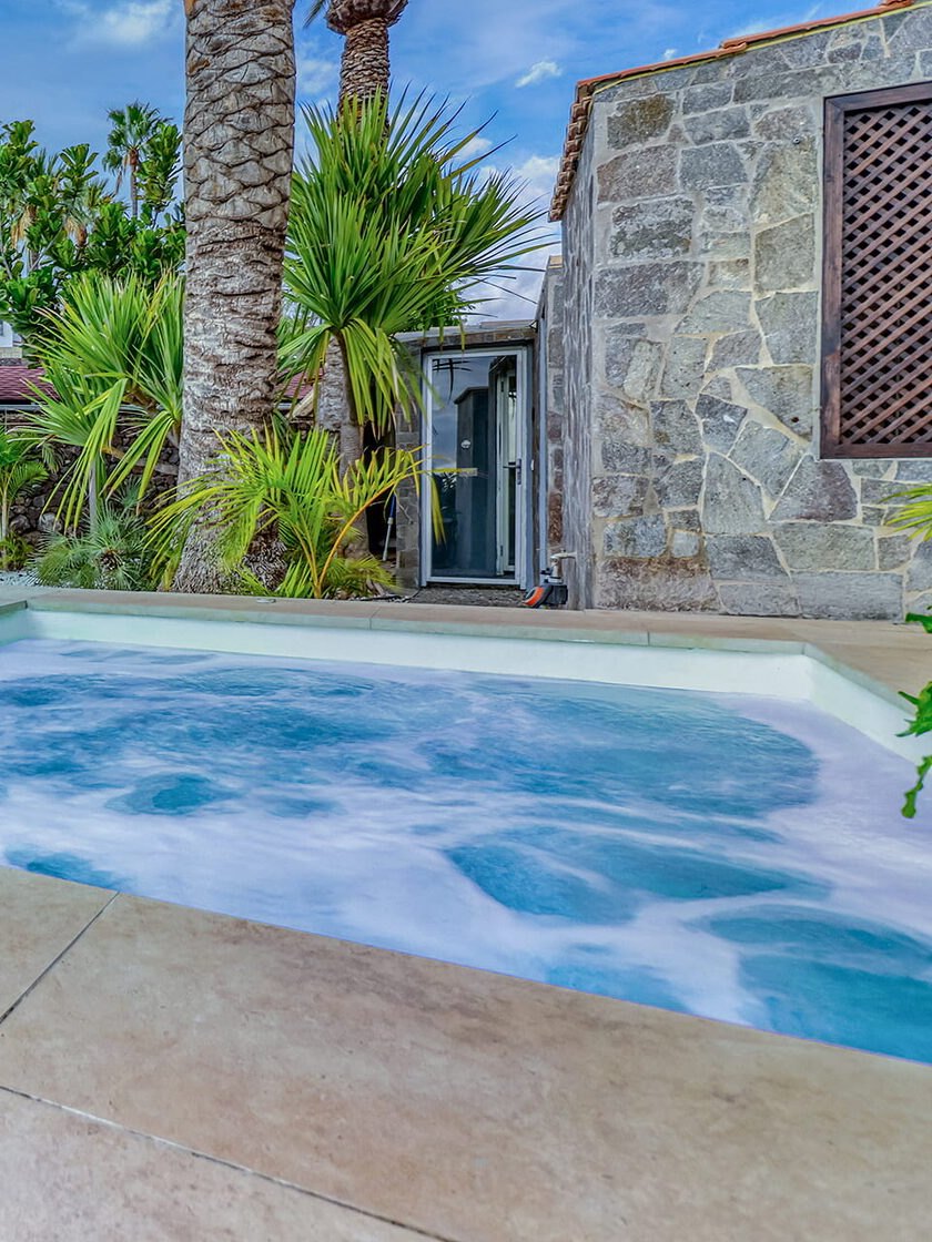 The stone Turkish bath next to the jacuzzi