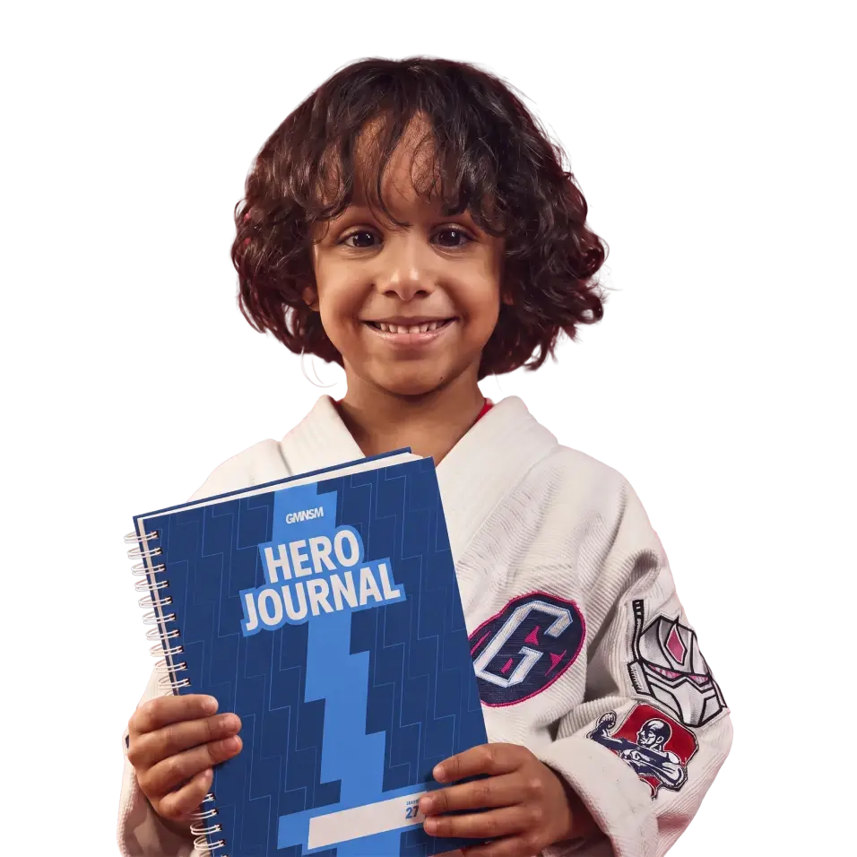 Young athlete holding a Hero’s Diary journal