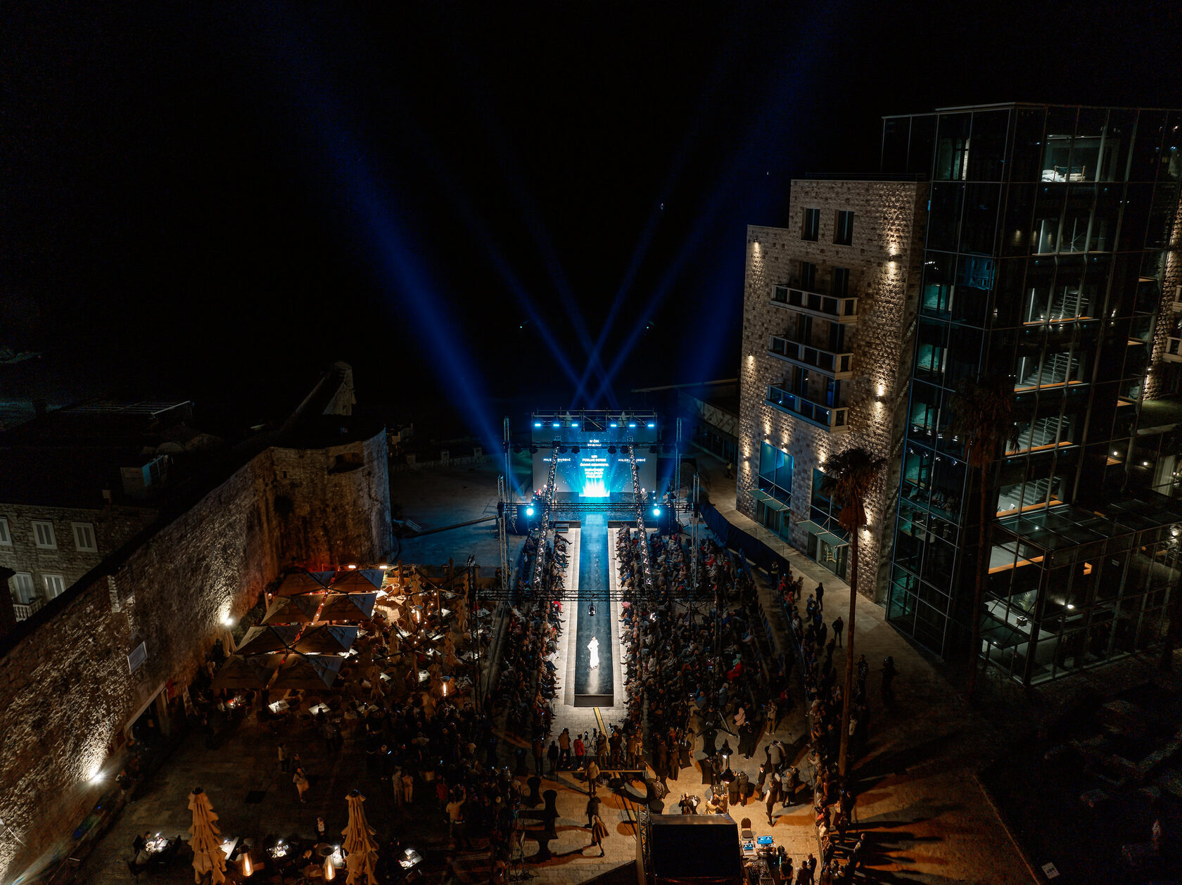 Blue stage lighting over Budva at night