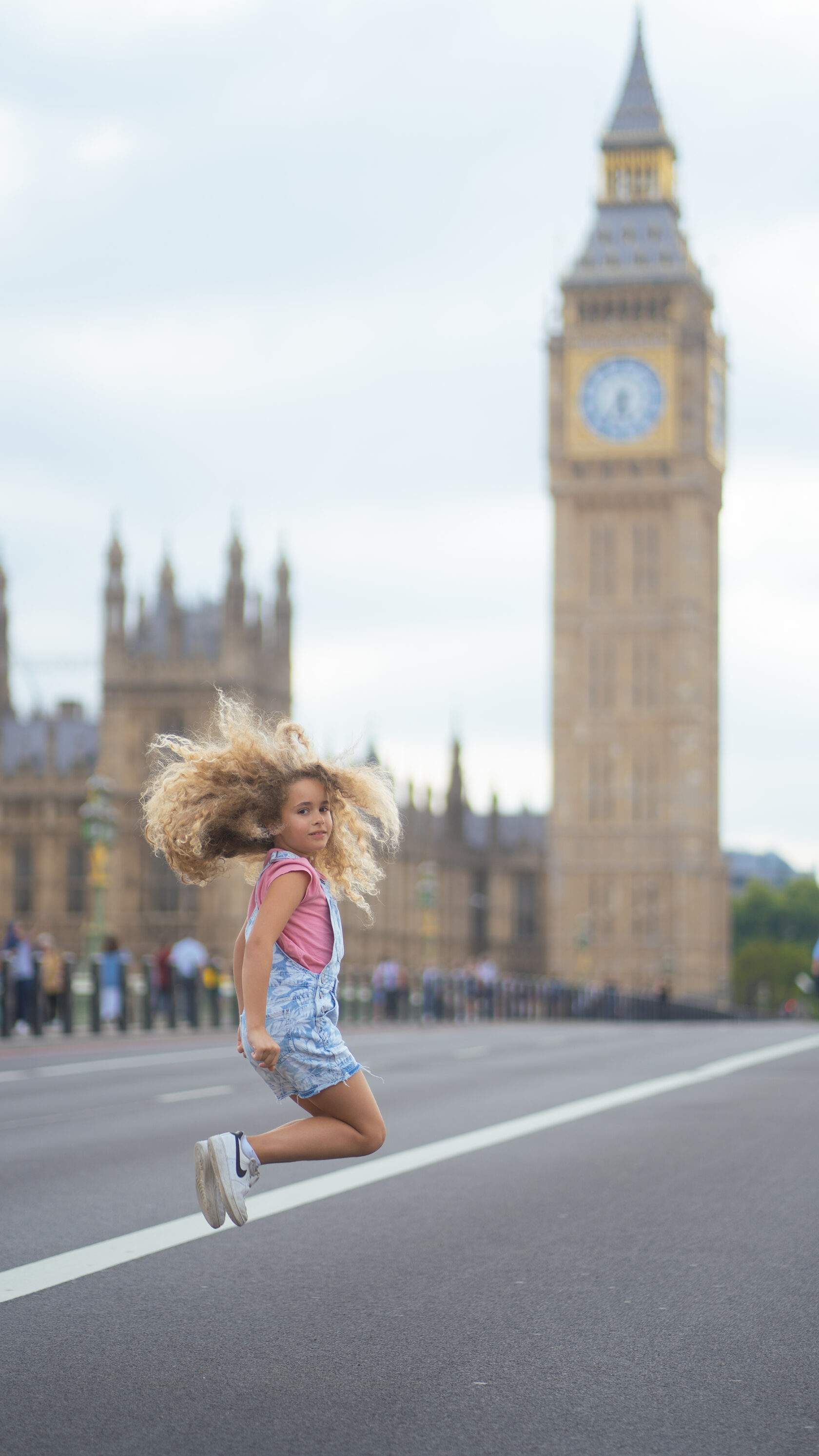 Child jumping with Big Ben in the background