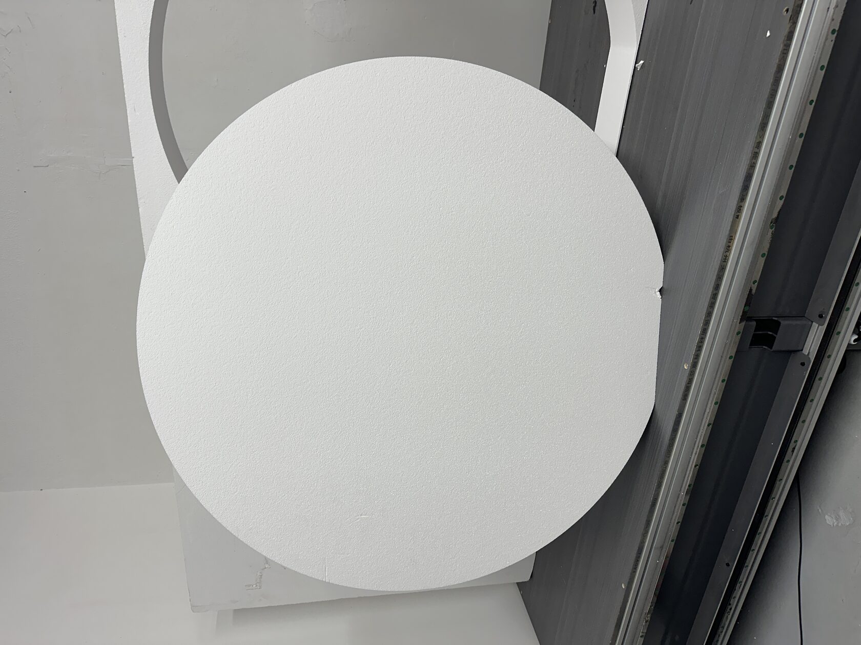 Raw circular foam blank for the Yesway logo before hardcoat and painting