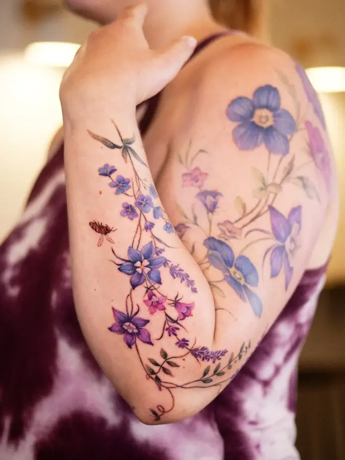 Floral arm piece with a bird