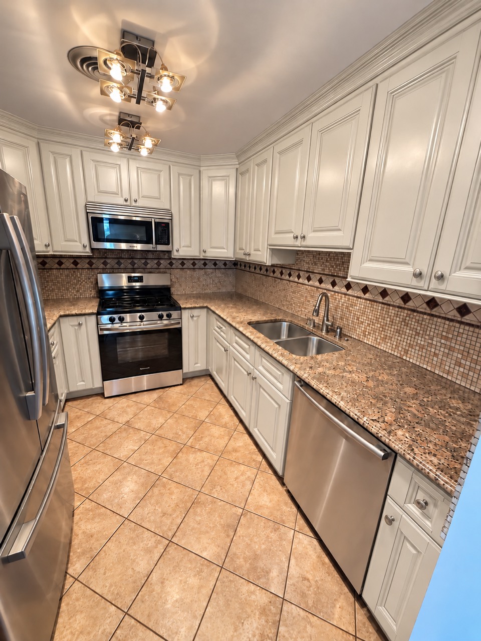 White raised-panel kitchen cabinets