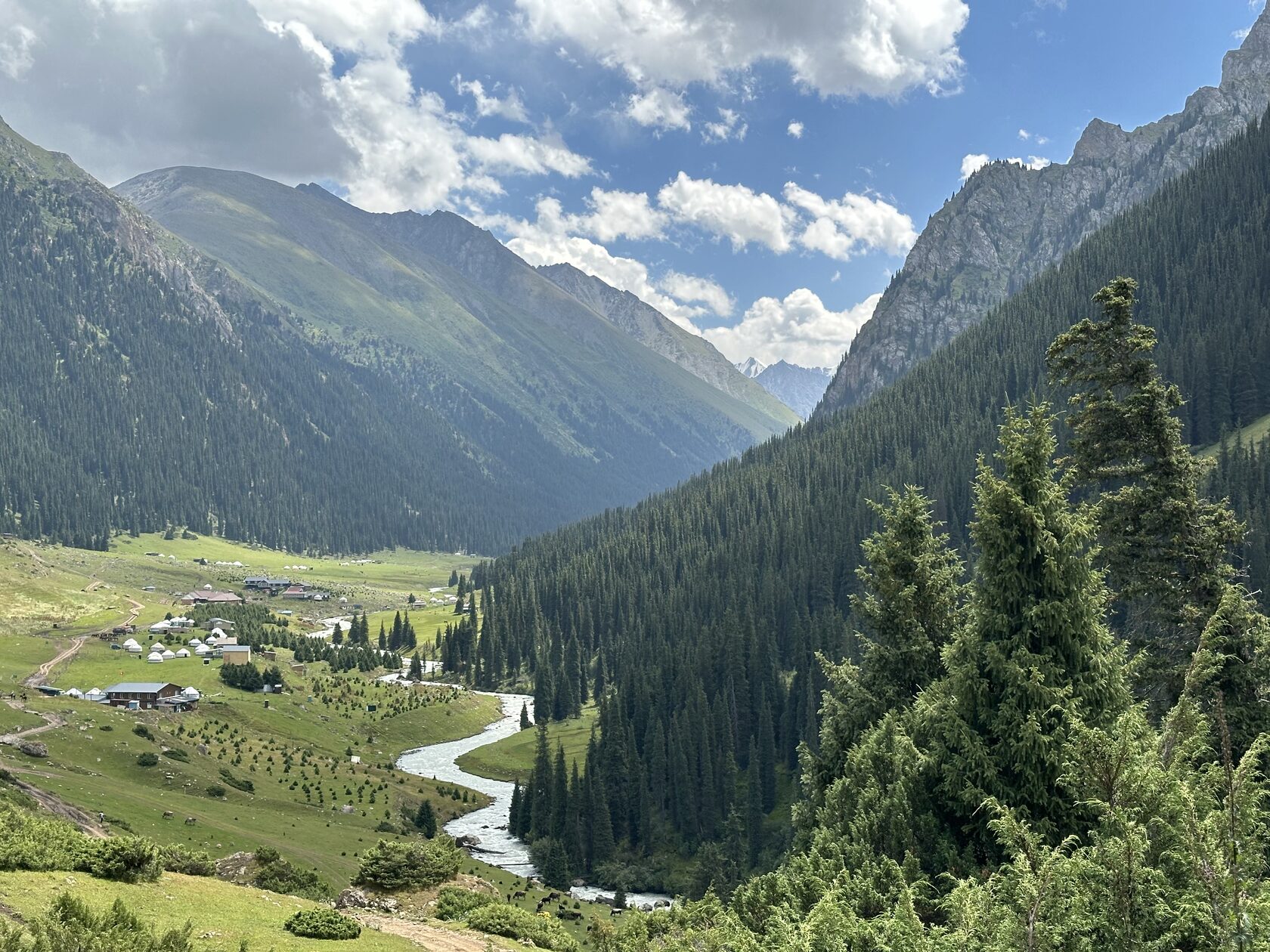 A Soviet-era 4x4 driving a rough mountain track towards the Altyn-Arashan valley