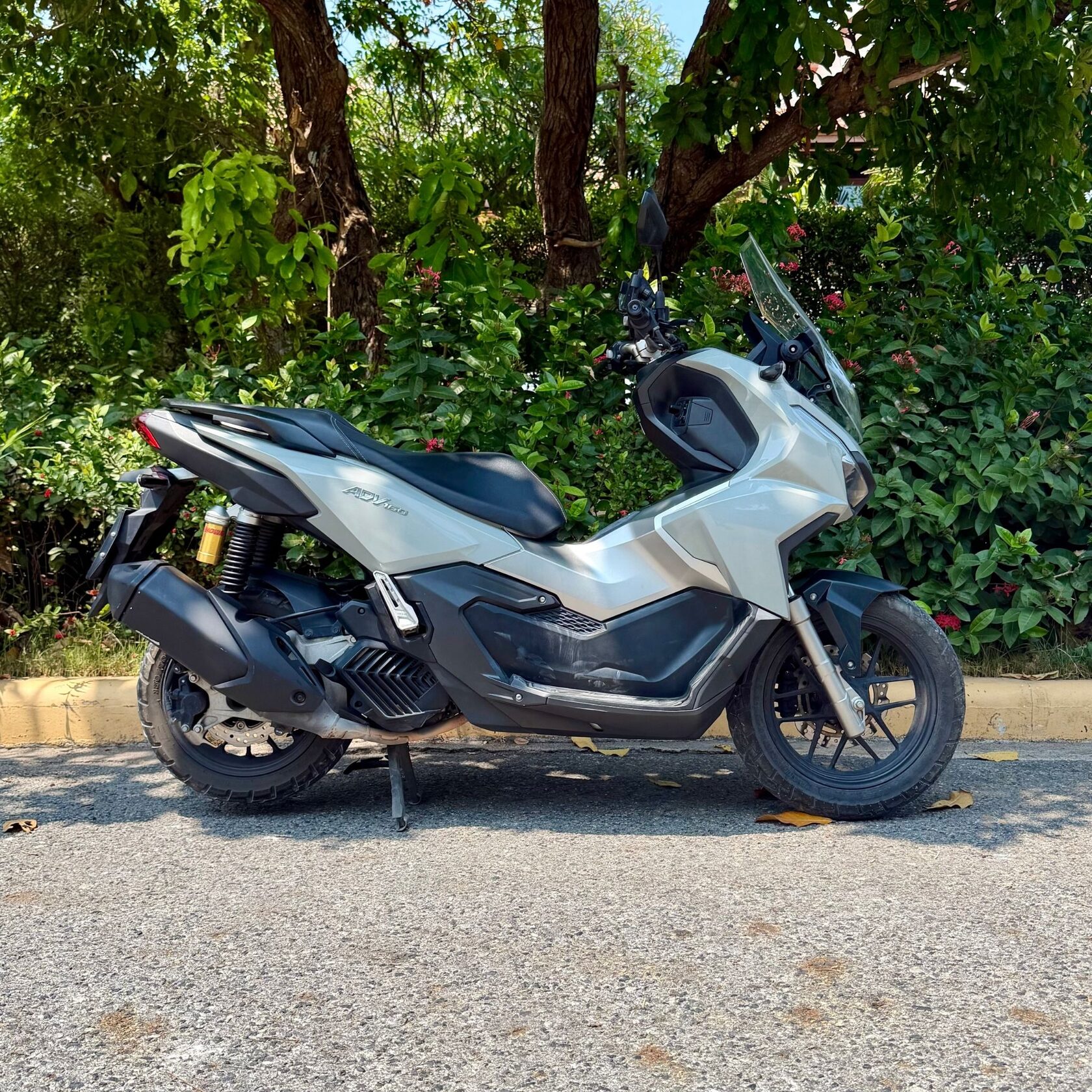 Khaki green 2025 Honda ADV 160 scooter with ABS and traction control right side view for rent in Pattaya