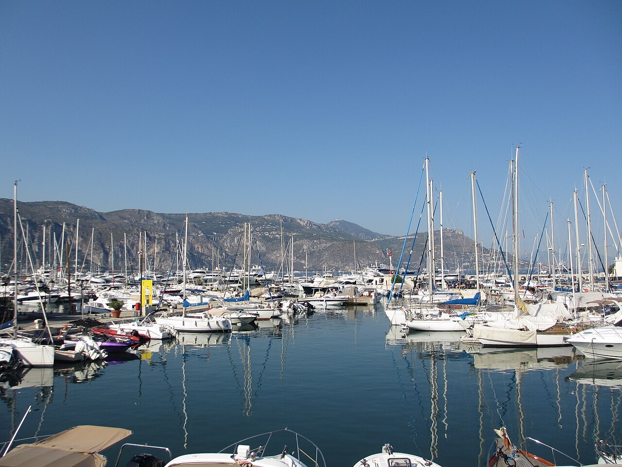 Saint-Jean-Cap-Ferrat harbour lined with boats and restaurants