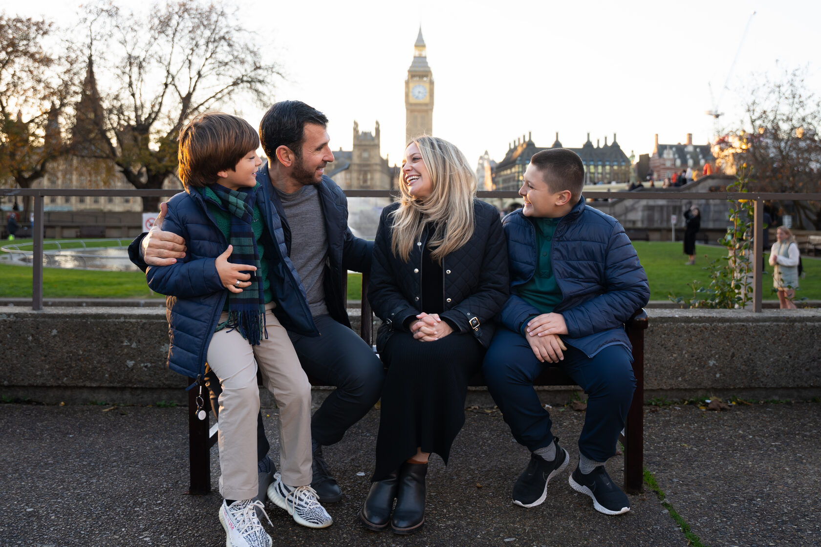Family enjoying a candid moment with Big Ben in the background