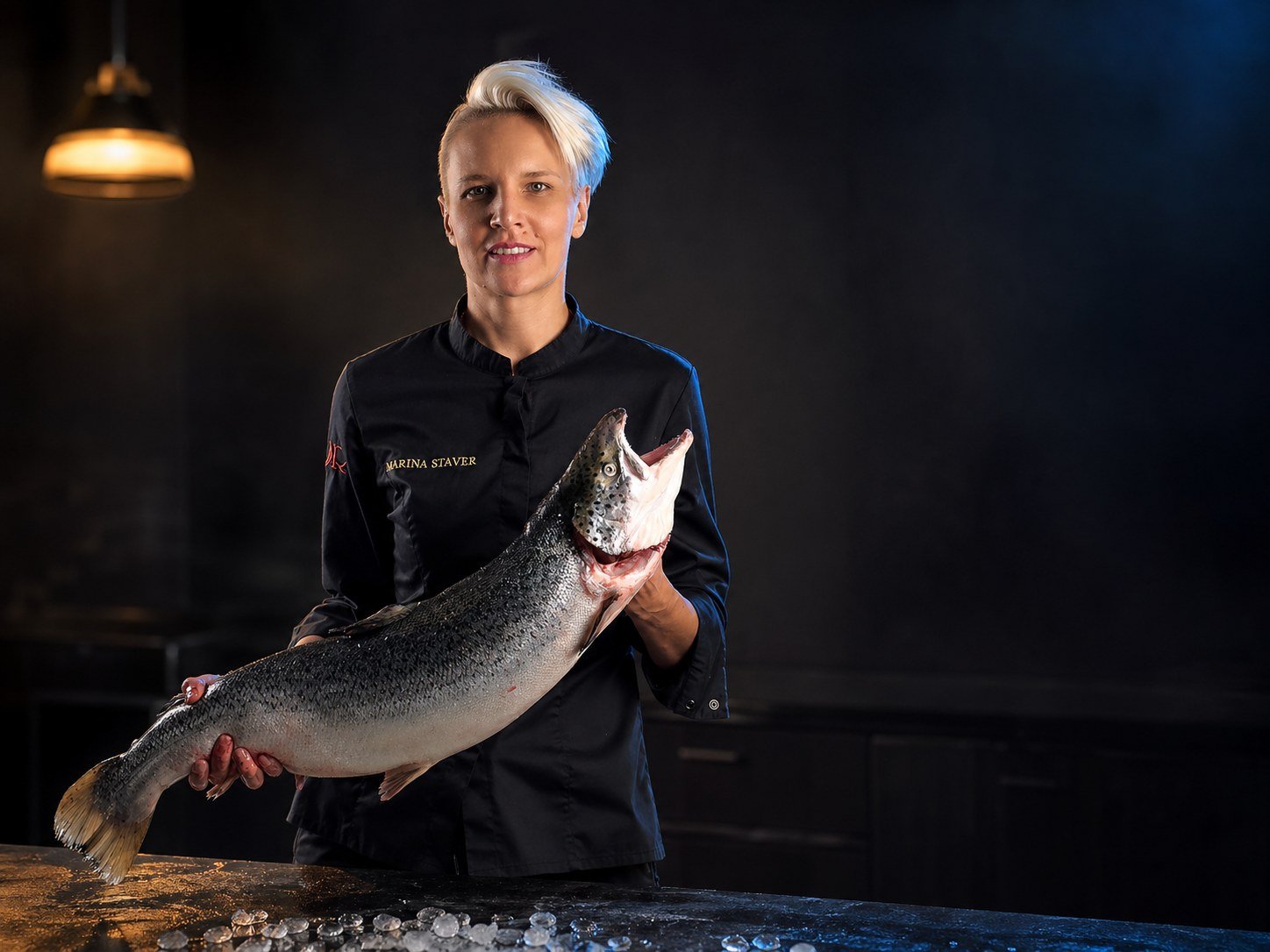 Private chef Marina Staver with whole Atlantic salmon for sashimi and crudo in Miami