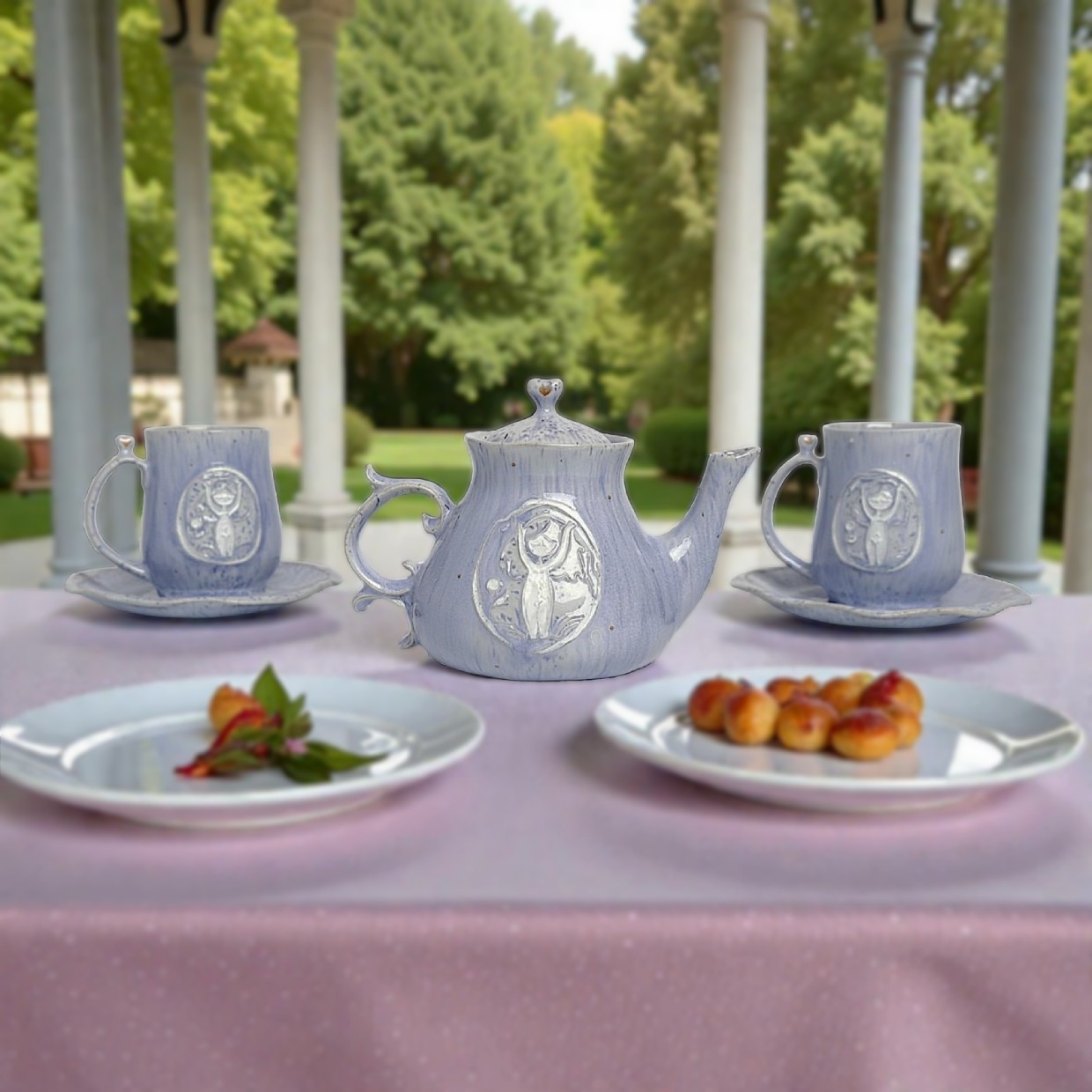 Handmade ceramic tea set — teapot and two cups with saucers, decorated with a raised design of a forest fairy on soft blue glaze. A unique whimsical tableware set
