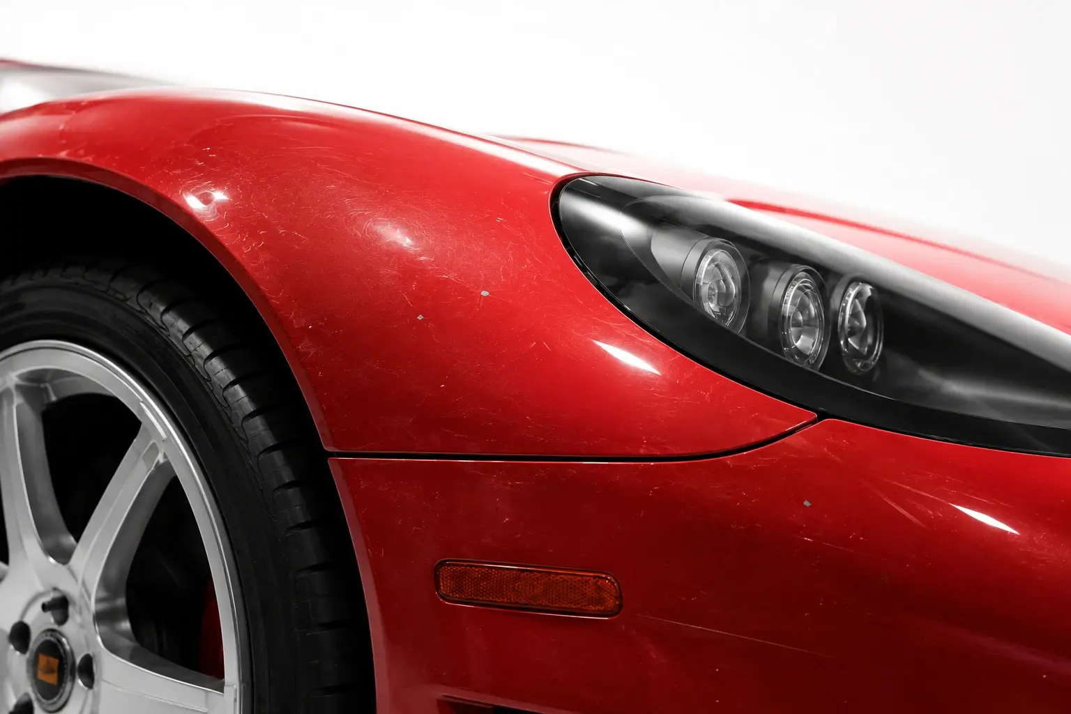 Red Saleen S7 paint with light scratches and stone chips