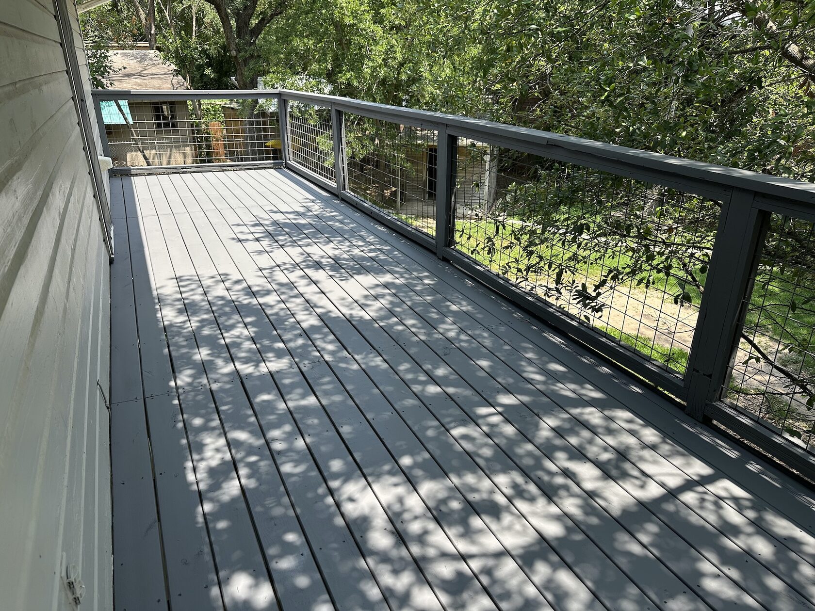 Two-level deck repair and painting project in Lakeway TX