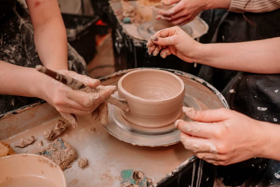 Friends enjoying a pottery class together