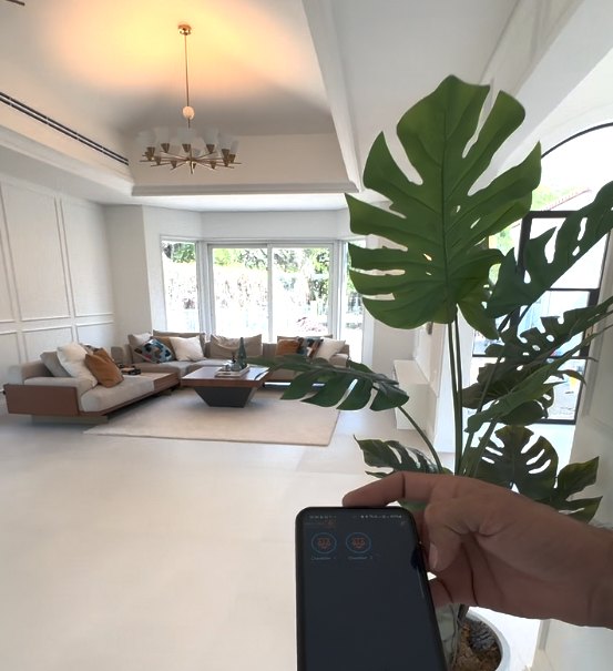 Dubai DIP Villa — living area and mobile control