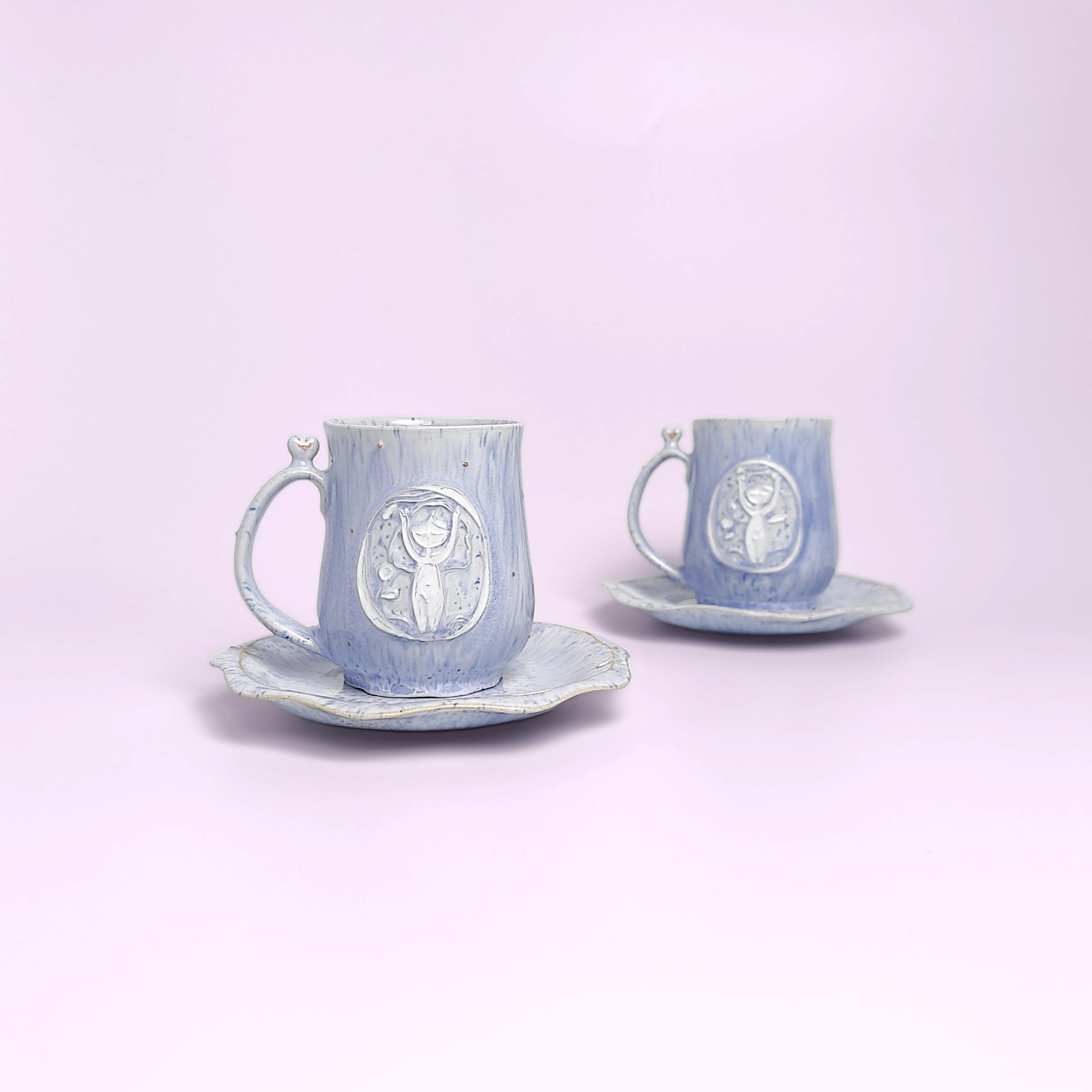 delicate blue handmade tea set — teapot, cups and saucers with carved forest fairy medallions