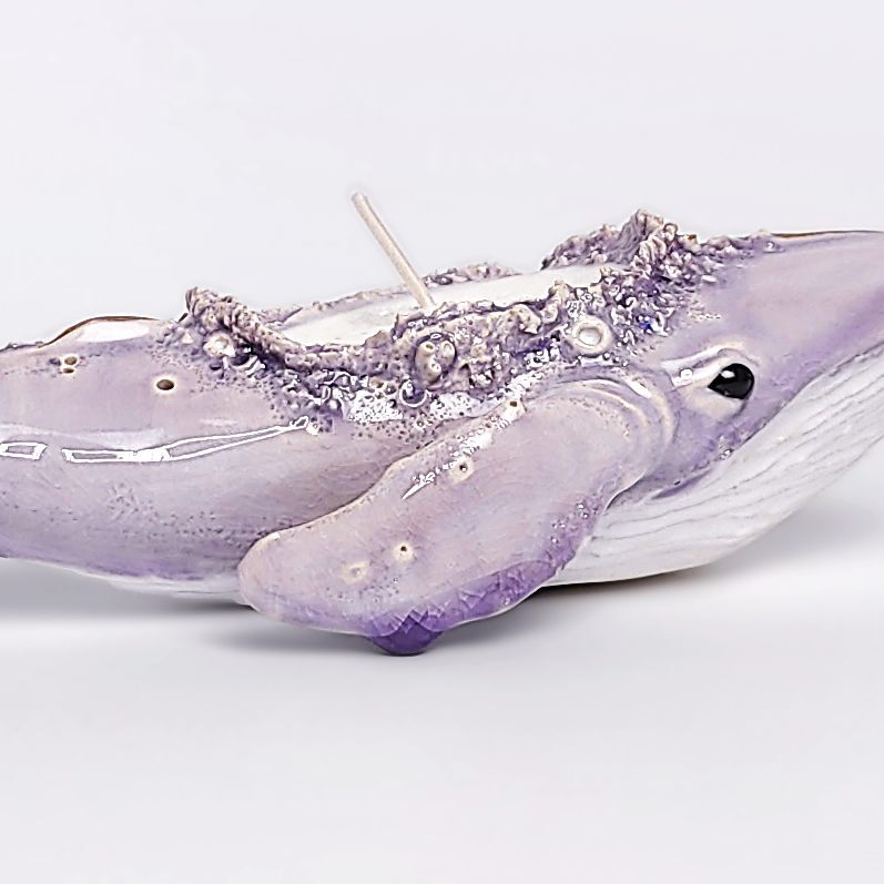 handmade ceramic candle holder shaped like a purple whale with sculptural details