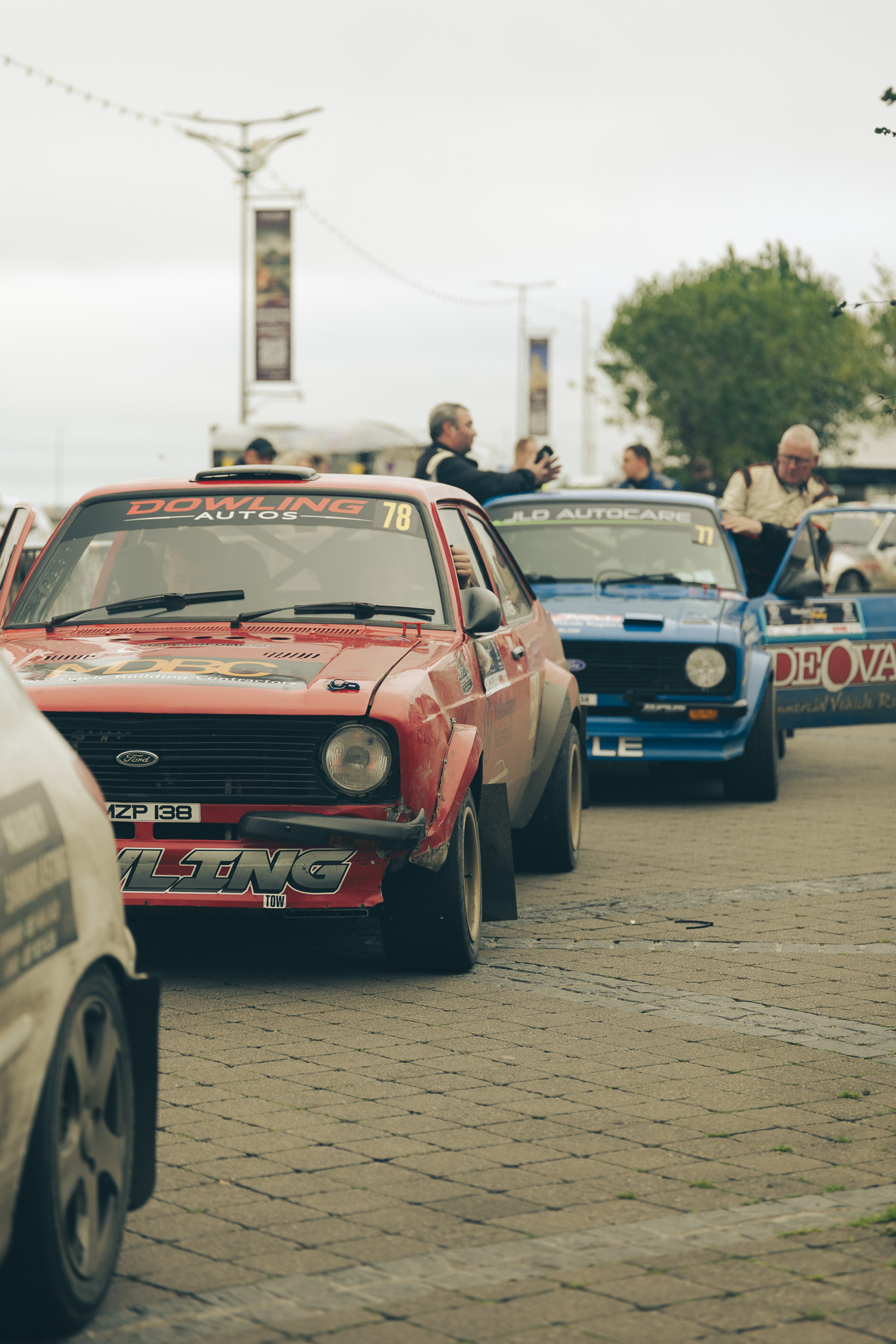 Red Ford Escort rally car lined up before stage start