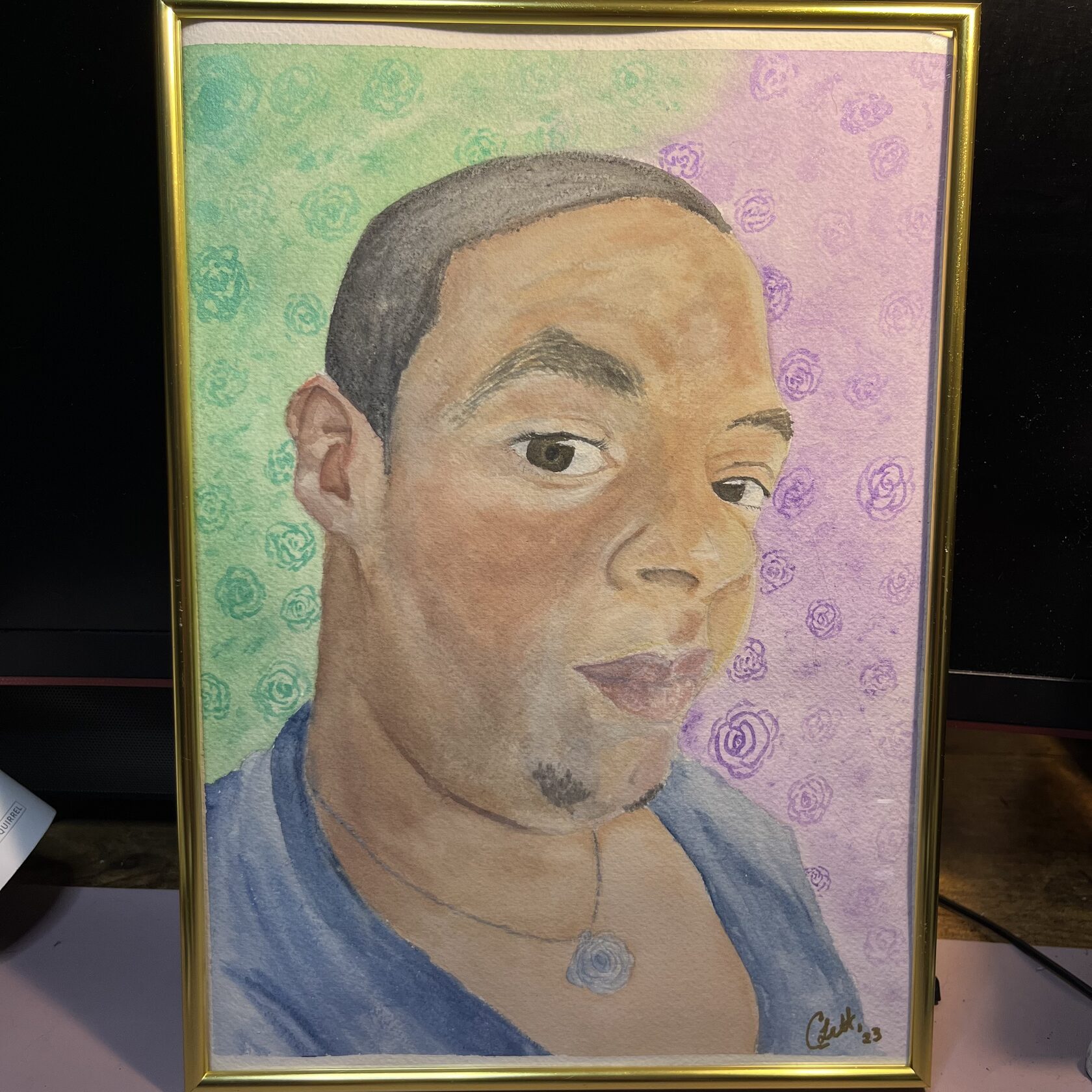 First Cut: Self, in Draft: watercolor self-portrait in a gold frame, with the complete artwork visible.