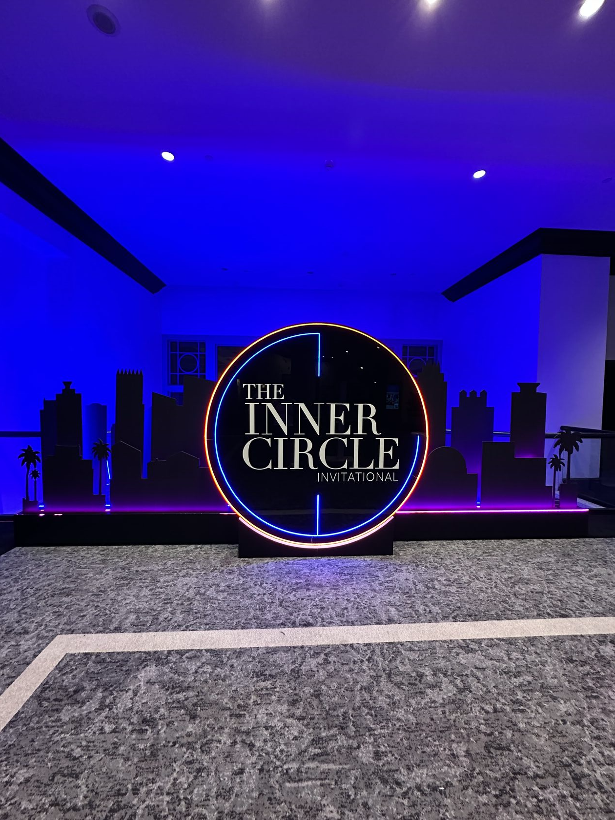 The Inner Circle Invitational illuminated Miami skyline backdrop installed at Loews South Beach