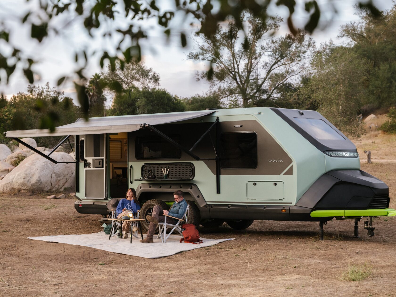 Evotrex PG5 trailer at camp with awning open