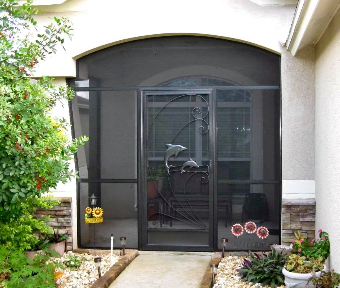 Hinged swinging screen door at a porch entrance