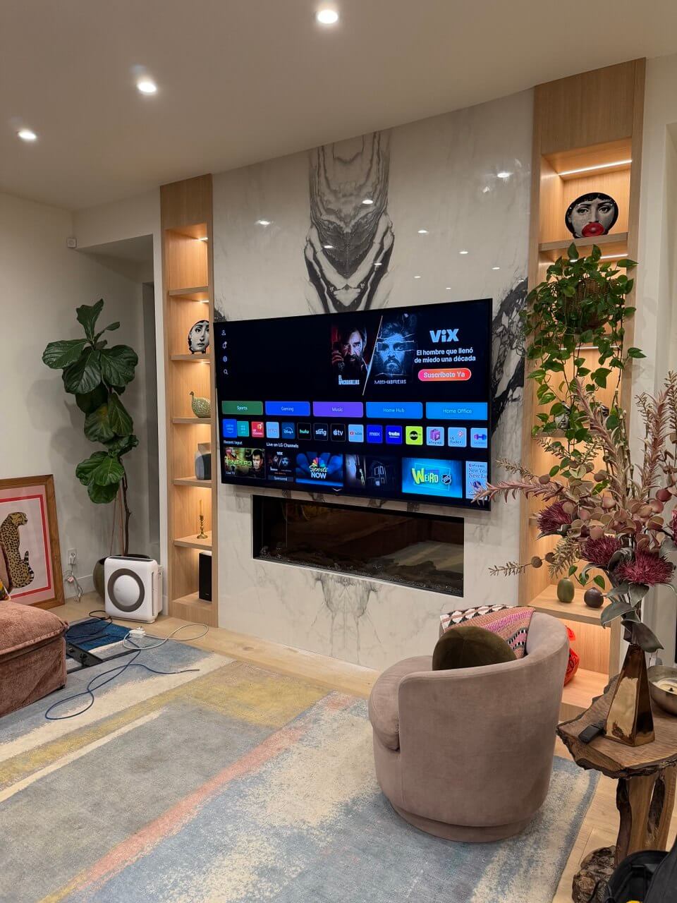 TV mounted above fireplace with hidden cables — Los Angeles