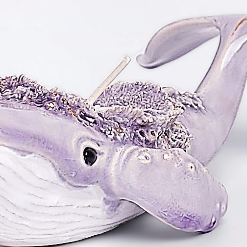 handmade ceramic candle holder shaped like a purple whale with sculptural details