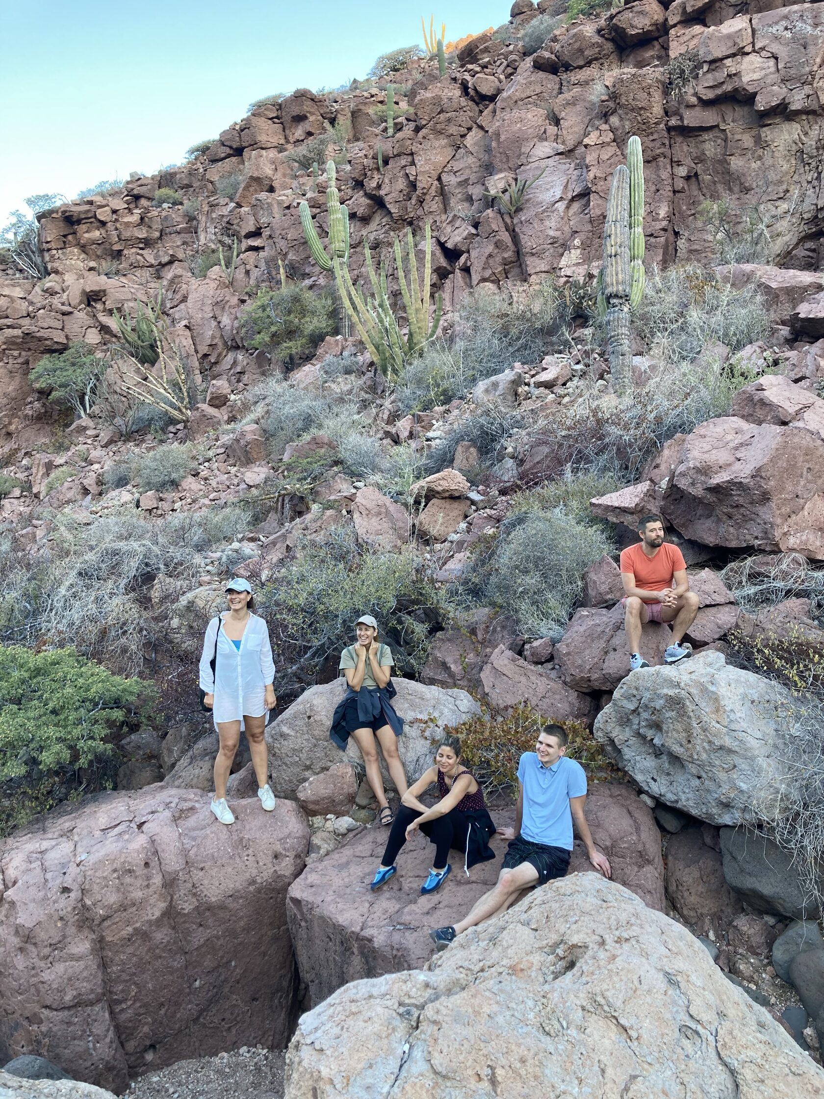 Guests hiking on volcanic rocks