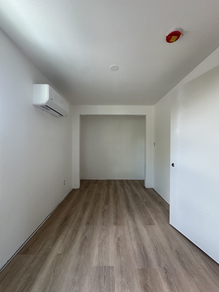 Interior finish stage · Consistent flooring and paint — Austin house flip by Kir Remodeling