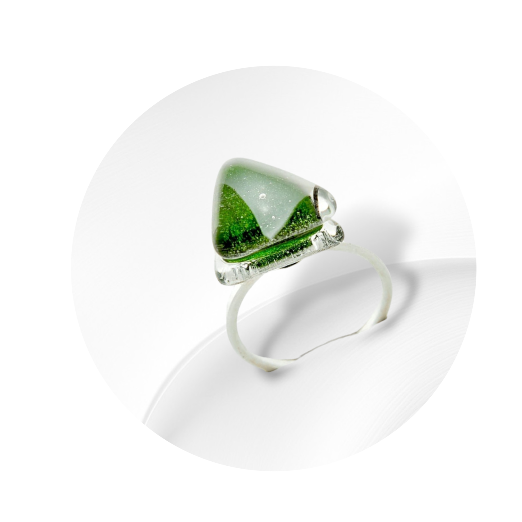 Sterling silver ring with a green art glass insert